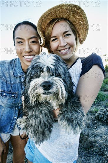 Close up of women smiling with dog