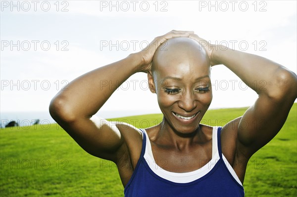 African American woman smiling in park