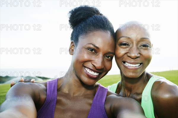 Women smiling in park