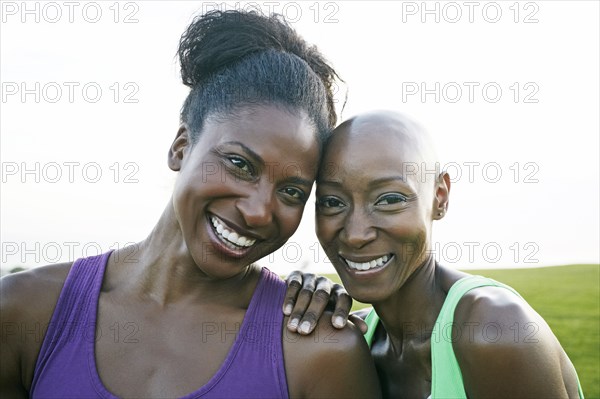 Women smiling in park