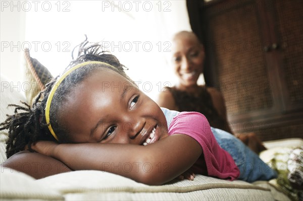 Black girl laying on sofa