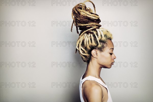 Black woman with dreadlocks bun