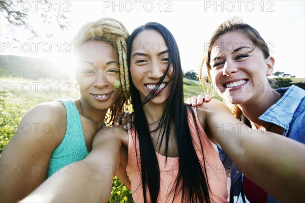 Friends taking selfie outdoors