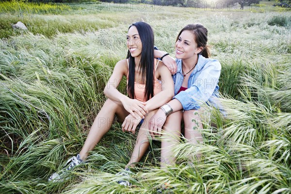 Women sitting in field