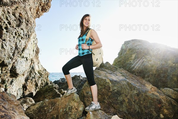 Woman hiking on boulders