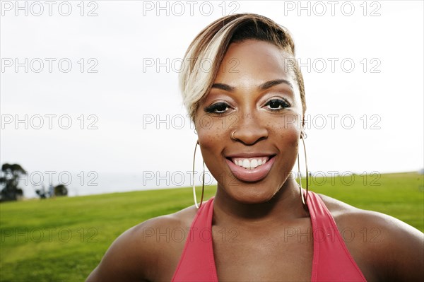 Black woman smiling in field