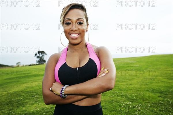 Black woman standing in field