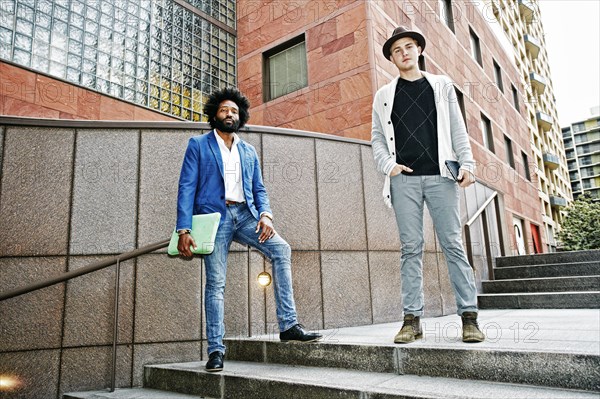 Businessmen standing on steps