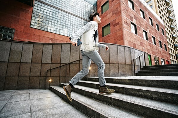 Caucasian businessman walking on steps