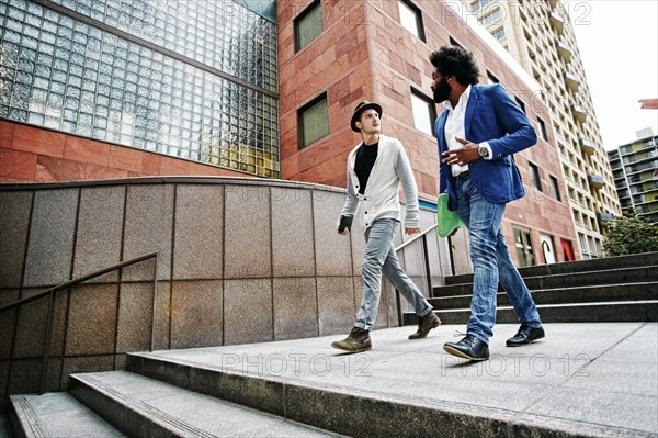 Businessmen talking on steps