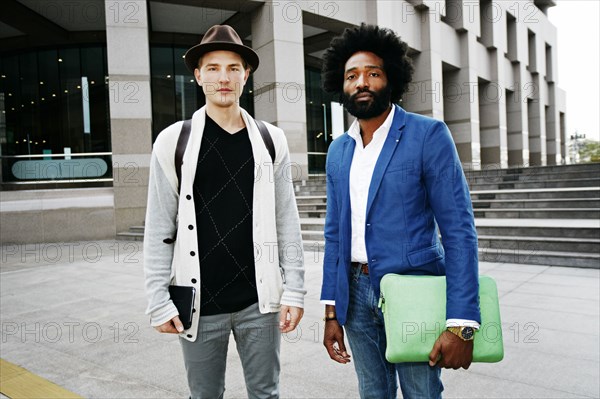 Businessmen standing in courtyard