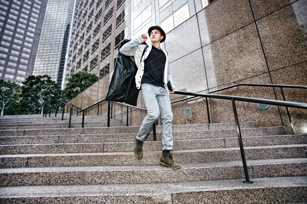 Caucasian businessman walking on steps