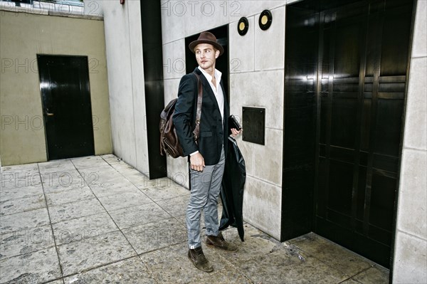 Caucasian businessman waiting for elevator