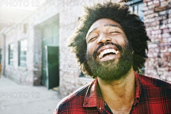 Mixed race man smiling outdoors