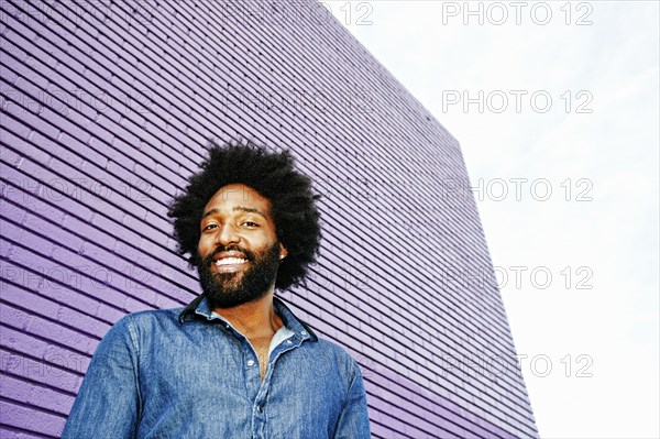 Mixed race man smiling outdoors