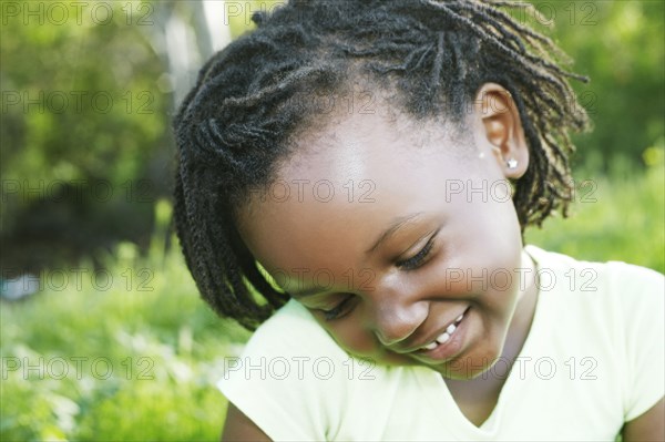 Black girl smiling outdoors