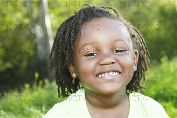 Black girl smiling outdoors