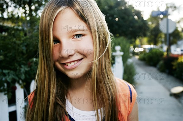 Caucasian girl smiling outdoors