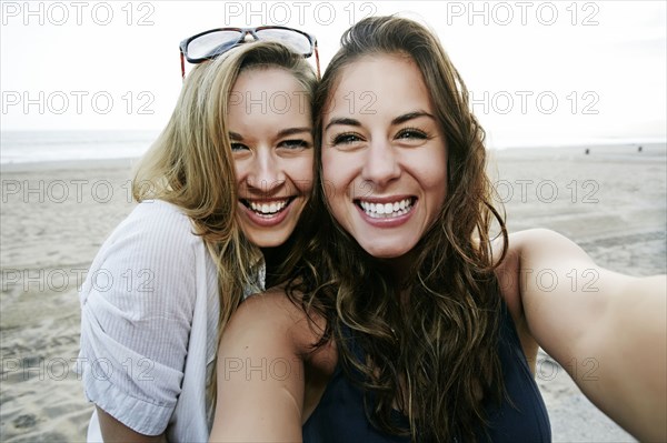 Women taking selfie on beach