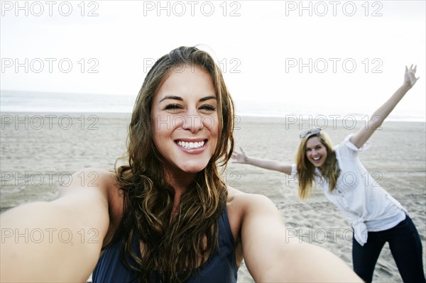 Women taking selfie on beach