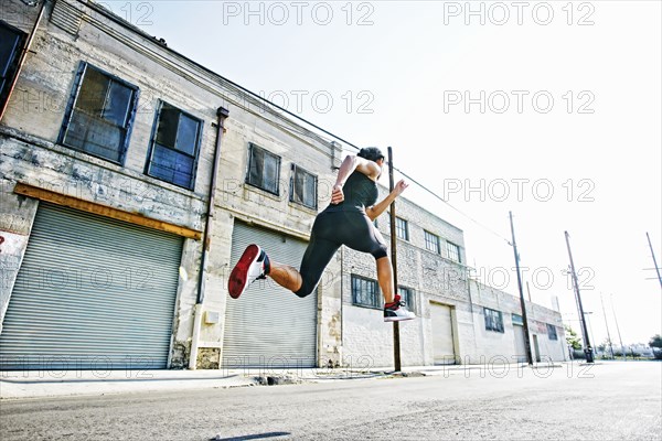 Mixed race woman running outdoors