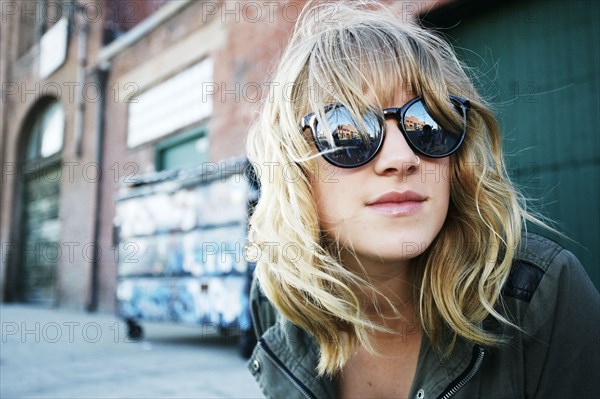 Caucasian woman wearing sunglasses outdoors