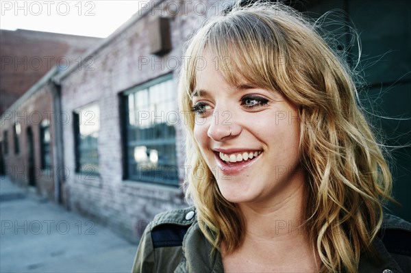 Caucasian woman laughing outdoors