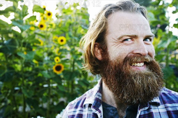 Caucasian man smiling in garden