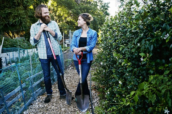 Couple working together in garden