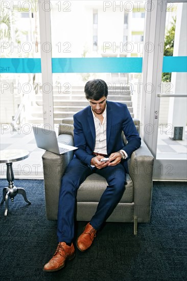 Caucasian businessman using digital tablet in office