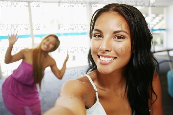 Smiling women posing indoors