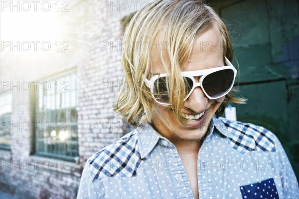 Caucasian man laughing outdoors