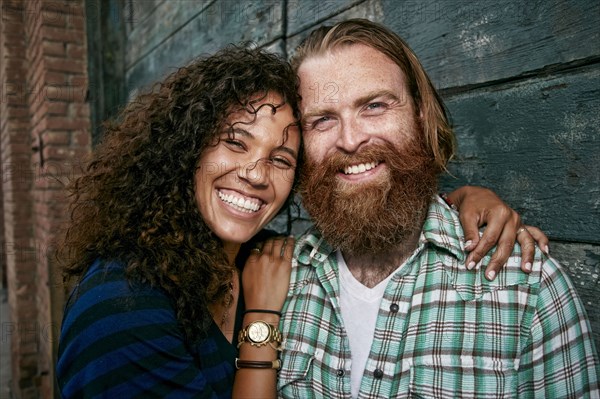 Couple hugging outdoors