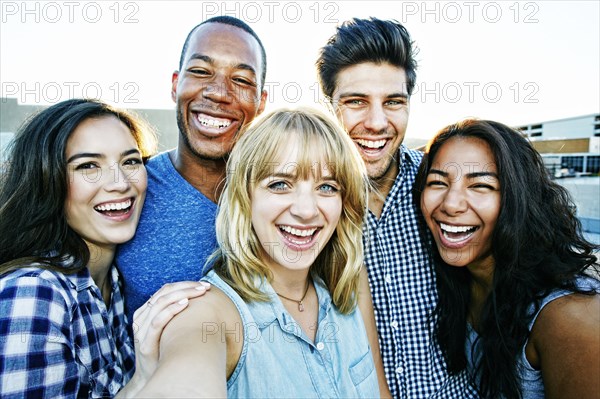 Friends posing for selfie outdoors