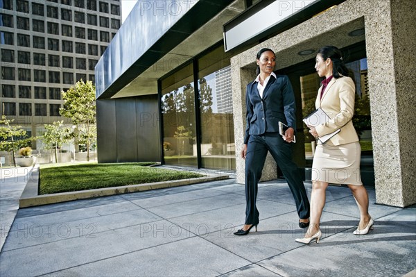 Businesswomen talking outdoors