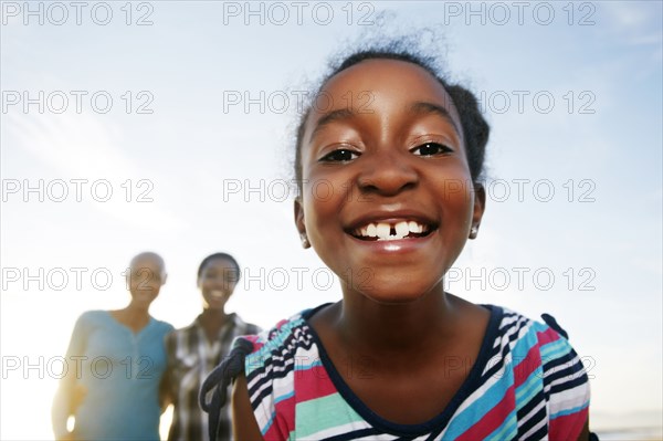 Black girl smiling outdoors