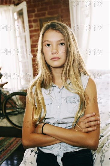 Serious Native American girl with arms crossed