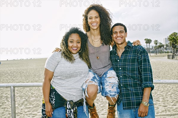 Friends smiling on beach