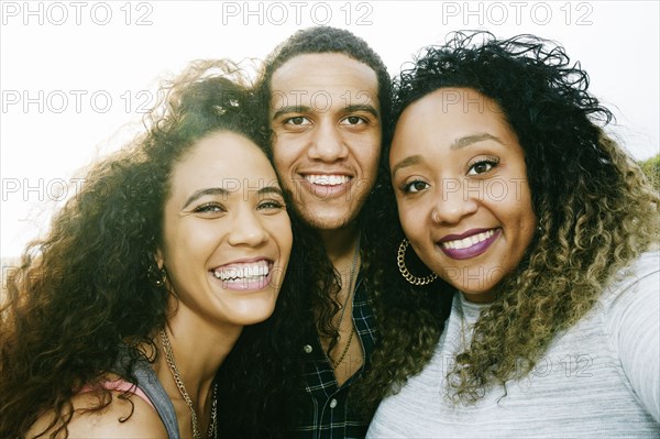 Friends smiling outdoors