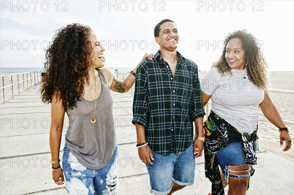 Friends laughing on boardwalk