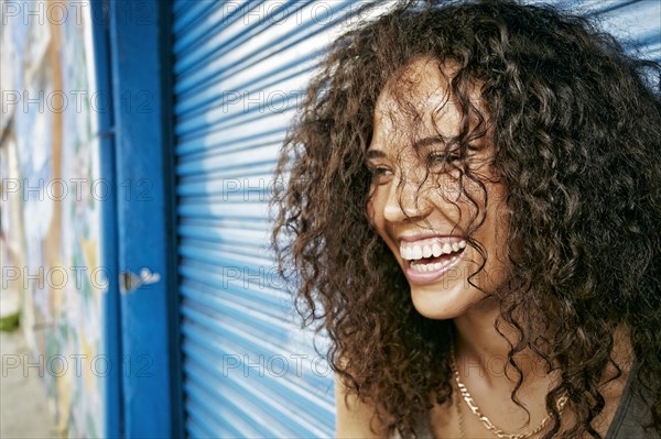 Mixed race woman laughing