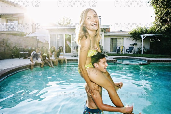 Couple playing in swimming pool