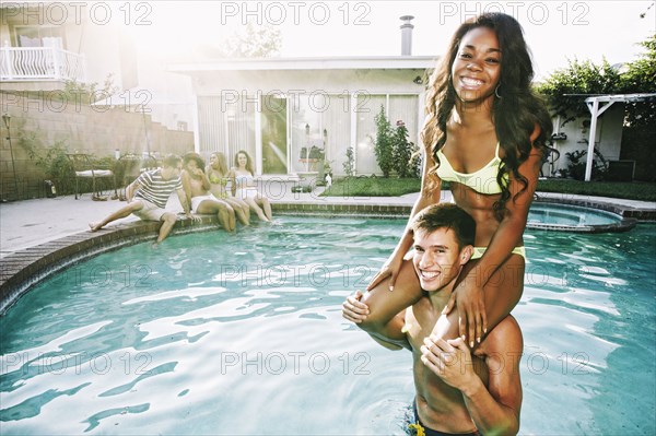 Couple playing in swimming pool