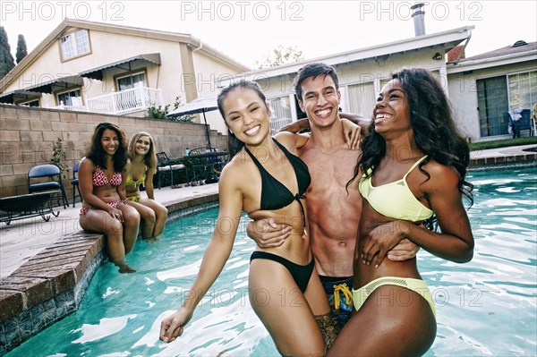 Friends playing in swimming pool