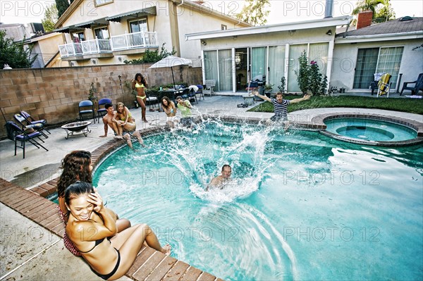 Man jumping into swimming pool