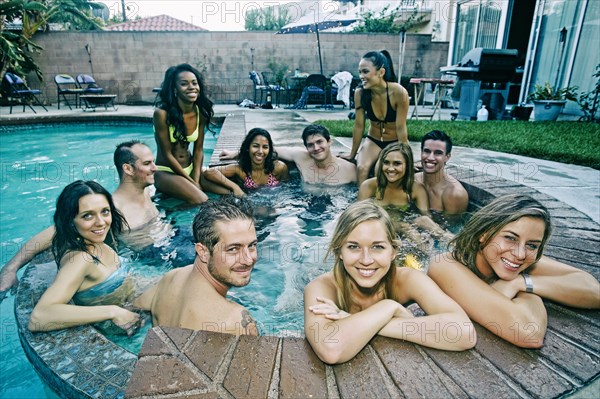 Friends relaxing in hot tub