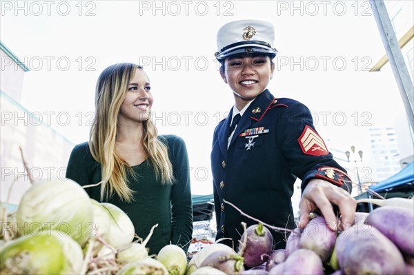 Soldier and friend shopping in farmers market