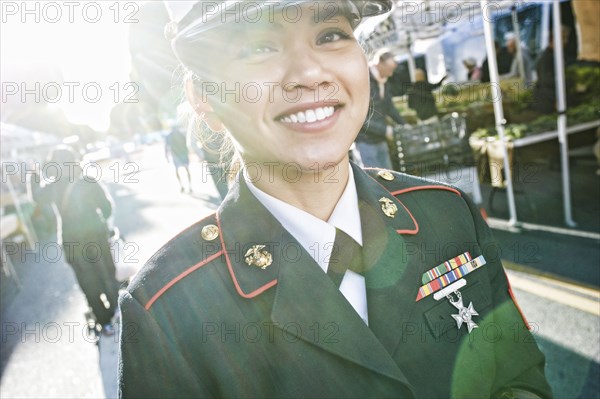 Asian soldier smiling in farmers market