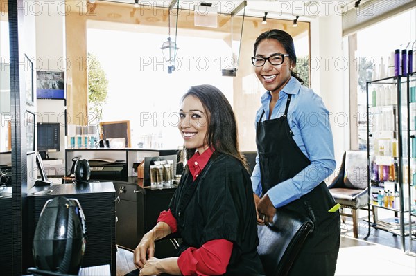 Hairdresser and customer in hair salon