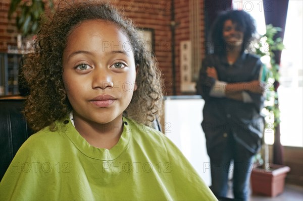 Serious customer with hairdresser in hair salon